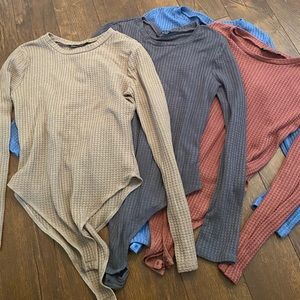 Four SHEIN Bodysuits